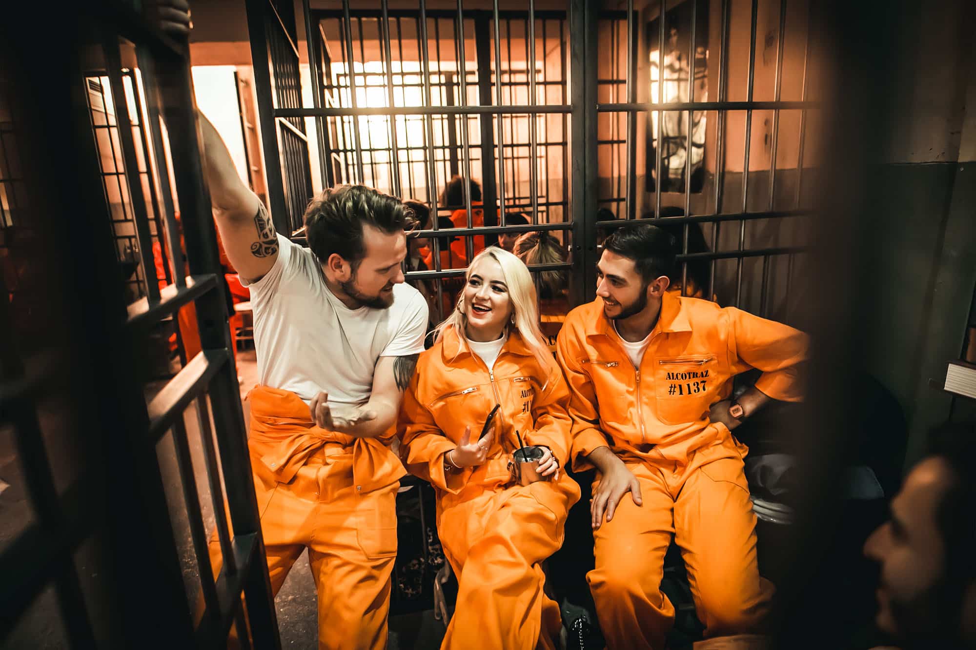 Couple on date night at Alcotraz Covent Garden - romantic prison-themed immersive cocktail experience.