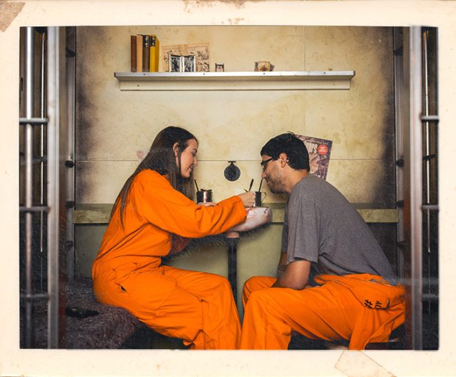 Couple enjoying date night at Alcotraz - prison-themed immersive cocktail experience for romantic evenings.
